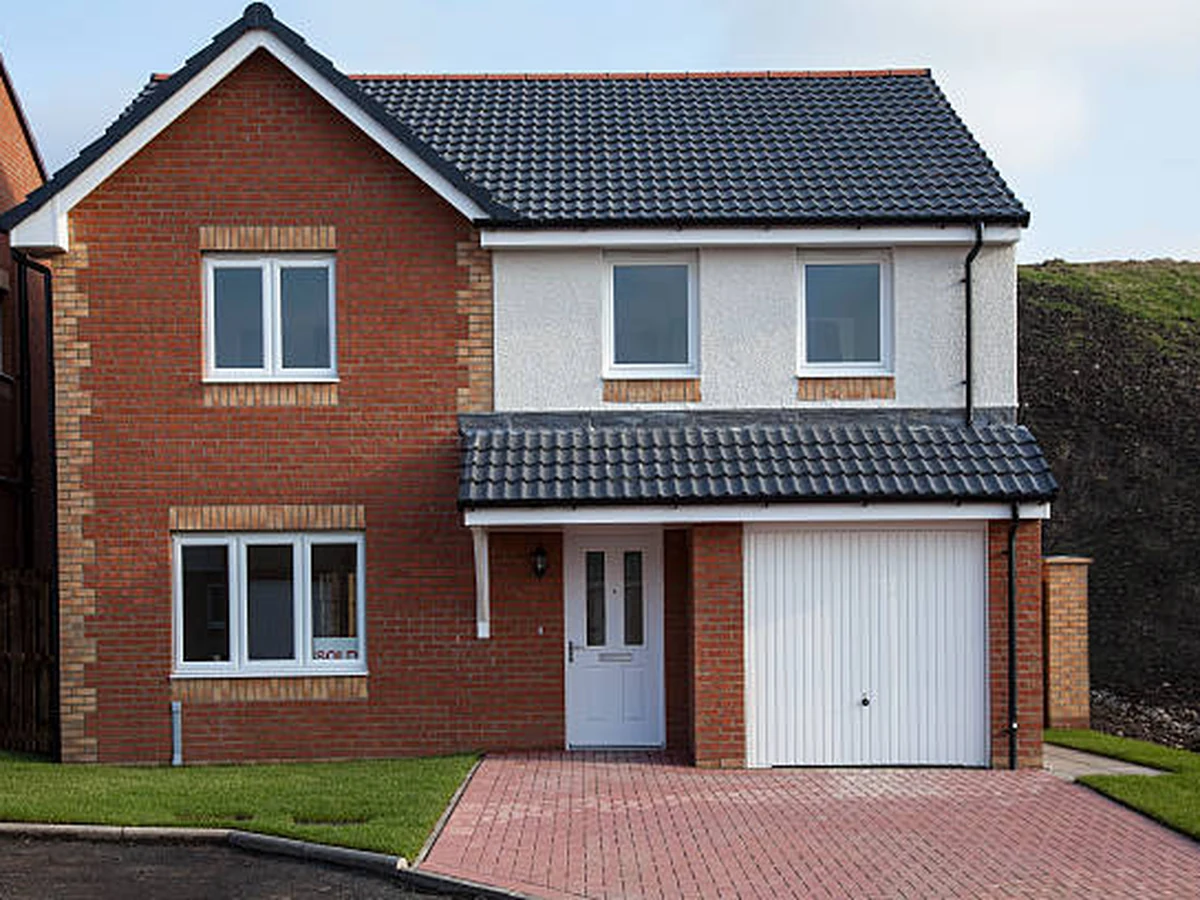 Exterior painting on a new build detached house in Wokingham, modern property with composite doors